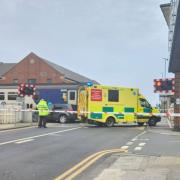 LIVE: Emergency services on scene train hits car on level crossing