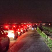 Cars were seen queuing for miles on Friday (May 10) to catch a glimpse of the Northern Lights as they were seen over the skies of the region