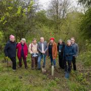Cllr Mark Wilkes (centre), Cabinet member for neighbourhoods and climate change, and Chris Harland (right), senior investment manager at the National Lottery Heritage Fund, pictured with members of the Durham Woodland Revival project
