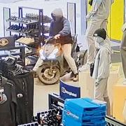 Kavan Conroy riding a moped in JD Sports in Newcastle