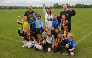 Youngsters in a Grangetown football club celebrating after securing a 20,000 pound grant to secure the future of their football pitches