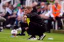 Eddie Howe crouches on the touchline during Newcastle's weekend draw with Brighton