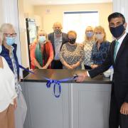 Rishi Sunak with village hall committee members at the re-opening of Barton Village Hall