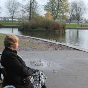 Joan Lawrence looks out across the lake at Darlington's South Park, where she played as a child. Picture: Peter Barron
