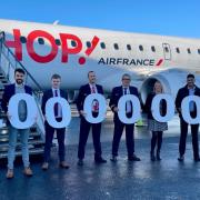 Air France and Newcastle International Airport staff on the tarmac to commemorate the 4 millionth passenger to fly through the airport so far this year.