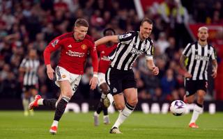 Dan Burn chases down Manchester United midfielder Scott McTominay
