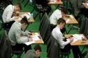 Embargoed to 0001 Tuesday July 30..Undated file photo of students sitting an exam. Poor teenagers are 18 months behind their wealthier peers in their GCSEs as progress in closing the divide has come to a standstill, according to a report. PRESS