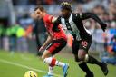 
Southampton's Cedric Soares (left) and Newcastle United's Allan Saint-Maximin battle for the ball during the Premier League match at St James' Park, Newcastle. PA Photo. Picture date: Sunday December 8, 2019. See PA story SOCCER Newcastle. Ph