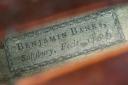 A detail of the maker’s label of the Benjamin Banks cello