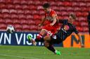 Hayden Hackney is tackled during Middlesbrough's Carabao Cup defeat to Barnsley