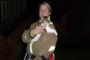 Firefighter Natalie Barnes with Lynx the adventurous kitten.