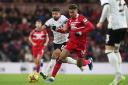 Morgan Rogers tries to break clear of Sam Morsy during Middlesbrough's defeat to Ipswich