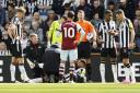 Jamaal Lascelles receives treatment during Newcastle United's win over West Ham