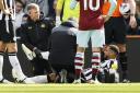 Jamaal Lascelles receives treatment on the pitch during Newcastle's win over West Ham