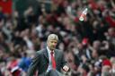 BOTTLED IT: Arsene Wenger kicks a bottle of water away during an Arsenal game, but physiotherapist Paul Gough has stressed the importance of taking on fluids after going for a night out