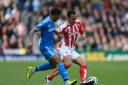 Stoke City's Peter Odemwingie (right) and Sunderland's Patrick van Aanholt battle for the ball during the Barclays Premier League match at the Britannia Stadium, Stoke. PRESS ASSOCIATION Photo. Picture date: Saturday April 25, 2015. See PA story SOCCER St