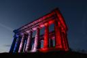 Penshaw Monument is bathed in blue, white and red lighting in tribute to the victims of the Paris terror attacks