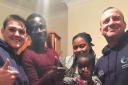 DELIVERY: Tommy Lowther (right) and his sister Cheyrlanne Lowther (left), of Sporting Force, with Omar Barrow (second left) and his family in Wakefield