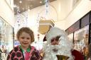 Santa spreads some Christmas cheer in Cornmill shopping centre. Picture: Allen White