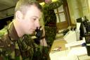 More soldiers such as this one – pictured manning an operations room during the 2002 firefighters' strike – could be enlisted to tackle train strikes, it has been reported