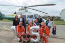 CELEBRATION: Great North Air Ambulance team and some of those who it has helped celebrate its 15th anniversary- Alison, Marc and Andrew Reed, Neil Wilson, Will Clark, chief executive Grahame Pickering, Aiden, Rachel and Scarlett Hall, pilot Phil Lambert,