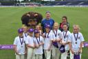 Coach Stephen Gilmore with girld from Sedgefield Cricket Club after winning a tournament last year at Durham Cricket Club
