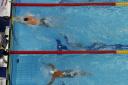 Gold medal winner Adam Peaty finishes ahead of fourth placed Brazil's Felipe Lima in the men's 50-meter breaststroke final