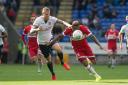 Britt Assombalonga of Boro battles with Bolton's David Wheater on Saturday Picture: MI NEWS AND SPORT