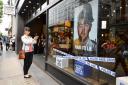 CAMPAIGN: A woman photographs the Lush store on Oxford Street, London, one of over 100 of their high street cosmetic stores facing a backlash for a campaign criticising undercover policing Picture: KIRSTY O'CONNOR/PA WIRE