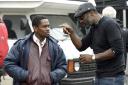 Undated film still handout from Yardie. Pictured: Aml Ameen as D and director Idris Elba on set. See PA Feature SHOWBIZ Film Elba. Picture credit should read: PA Photo/StudioCanal. All Rights Reserved. WARNING: This picture must only be
