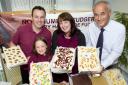 IT’S YUMMY, MUMMY: Stephen and Michelle Prest with their eight-year-old daughter, Holly, who is the company’s self-styled chief taster, and Nick Johnson, from UK Steel Enterprise