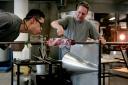 SEEING CLEARLY: Glass blower Ian Spence at work with student Choong Mokyoo, left