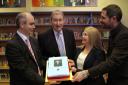 Retiring executive director of Longfield School Keith Cotgrave is presented with a personalised cake by Calvin Kipling, left, head of DSMS School, Susan Johnson, head of Longfield and John Armitage, head of the Rydal Academy, right