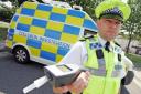 APPEAL BY POLICE: Acting Inspector Mark Richardson in front of a road policing vehicle