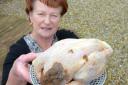 Marjorie Pearson with the offending chicken. Picture: NORTH NEWS