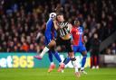 Fabian Schar challenges Jean-Philippe Mateta during Newcastle's defeat to Crystal Palace