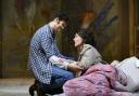 Thomas Atkins as Rodolfo and Katie Bird as Mimi in Opera North’s revival of La Bohème