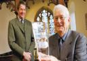 FAREWELL: Bill Carvey, who served as Church warden at St Mary’s, is presented with a vase by Sir Mark Wrightson to mark his retirement after 40 years