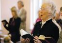 ON MESSAGE: Agnes Hall gets into the spirit of the service as the hymn singing begins
