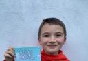 Jacob Carnes with his published book which is available to buy on Amazon and Ebook