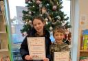 Skyler and Corby Wilson receiving challenge certificates