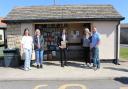 Rishi Sunak at the Scorton Bus Shelter book store – a history of the Stockton and Darlington Railway - with the Bus Shelter Buddies; from left, Sophie Newall, Linda Hutchinson, Kathy Bryan and Andy Young – with Harris