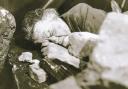 BADLY INJURED: Ena Sharples, played by Violet Carson, lies injured in rubble after a train crashed off the viaduct