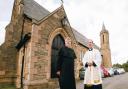 NEW PARISH PRIEST: Father John Livesley, right, with father-in-law Father Peter Anderton, outside St Andrew’s Church, Tudhoe Grange