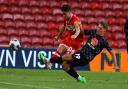 Hayden Hackney is tackled during Middlesbrough's Carabao Cup defeat to Barnsley