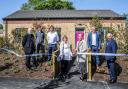 Amanda Bloor cuts the ribbon to mark the official opening of the scheme, next to Helen Simpson, Broadacres’ Chair, and partners