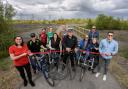 Representatives from Durham County Council, Sustrans, and local cycling and walking groups cutting the ribbon at NCN1 improvements at South Hetton