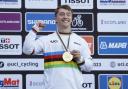 Kieran Reilly celebrates after winning gold at the World Cycling Championships