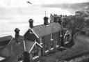 Sandsend railway station in 1962, four years after the railway closed, looking right round the bay to Whitby on the clifftop in the distance