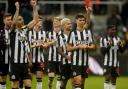 Newcastle players celebrate the win over Chelsea